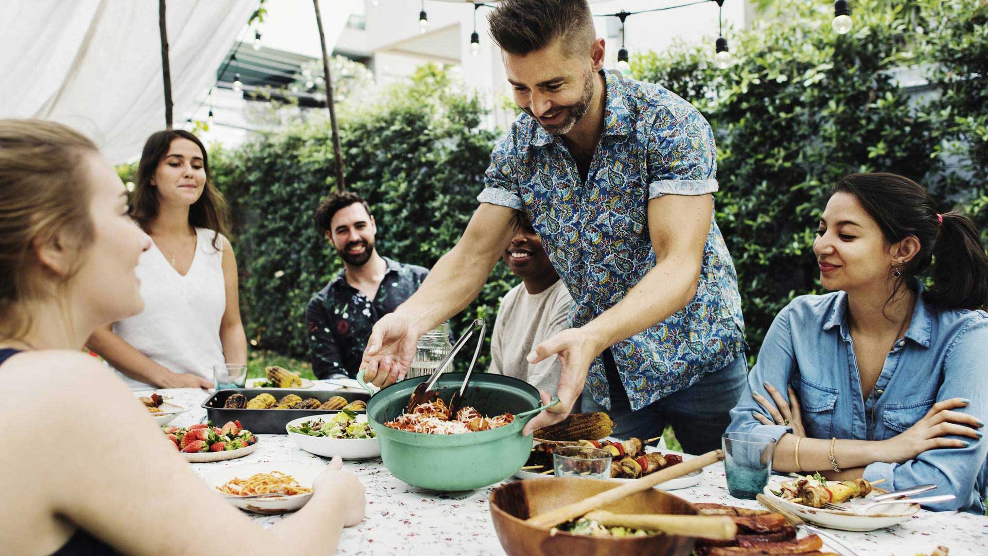 middle aged people enjoying a meal