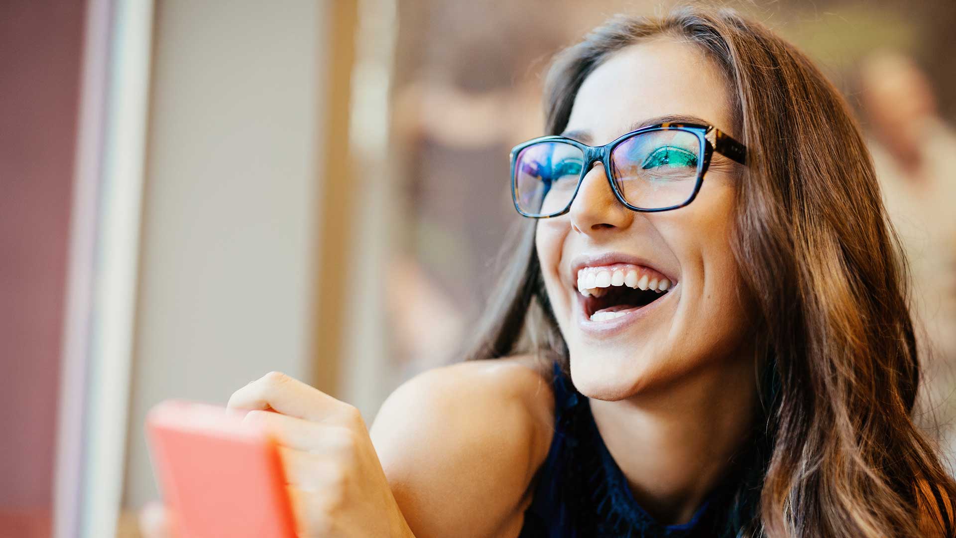 young smiling woman with glasses