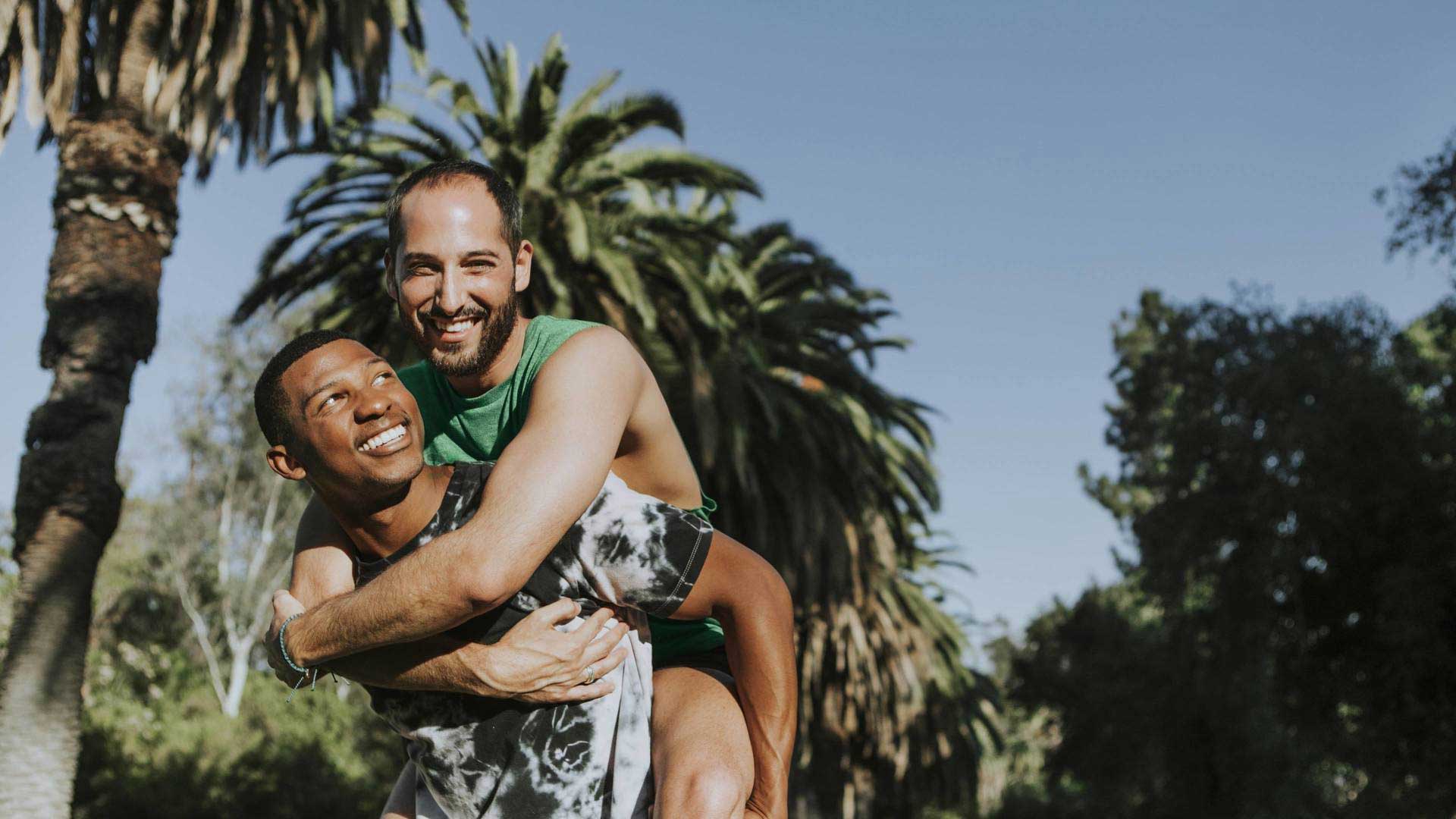 young men piggy back