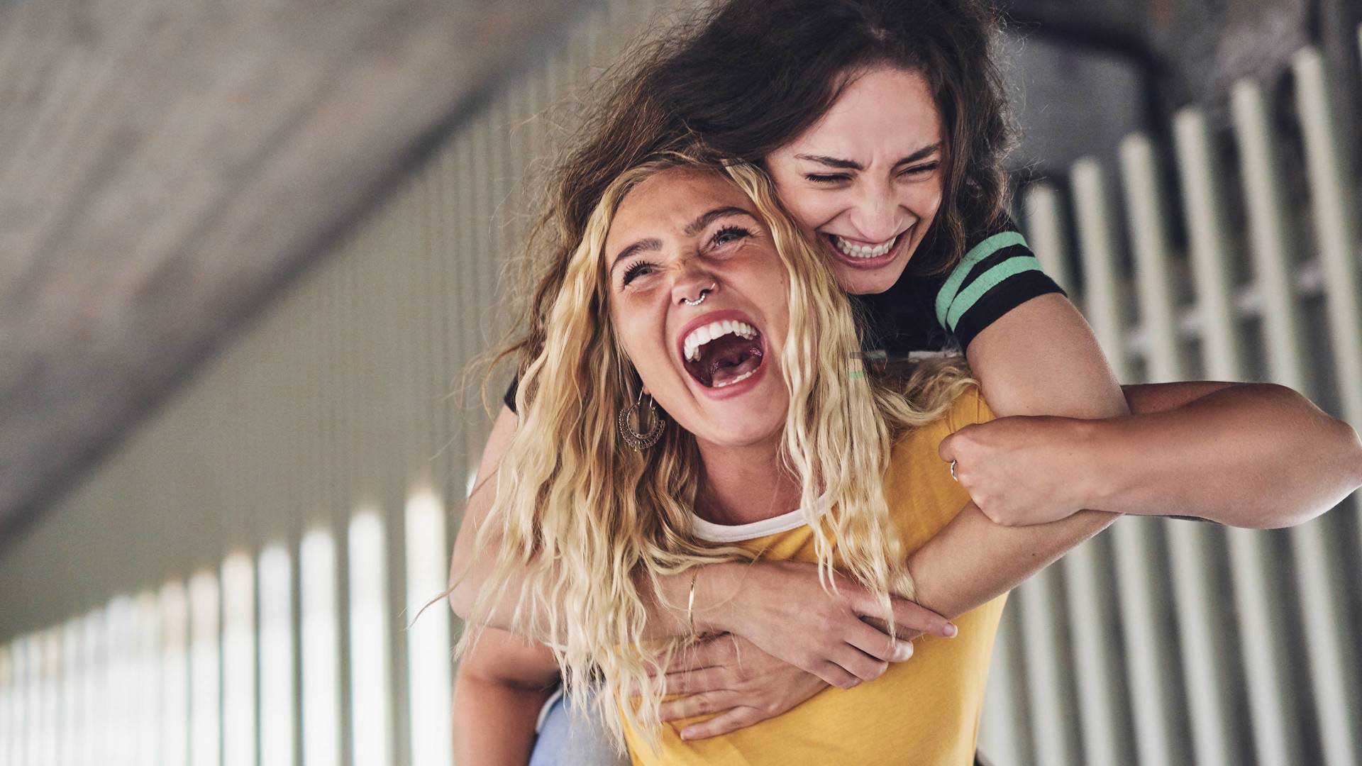 young women piggyback